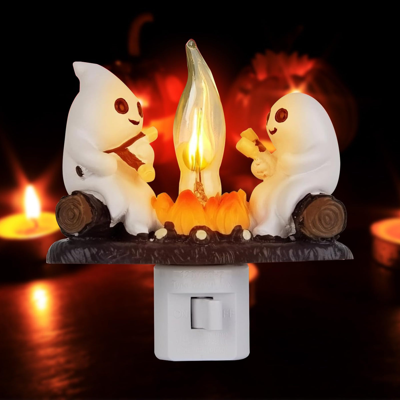 Two small ghosts gathered around a glowing campfire night light